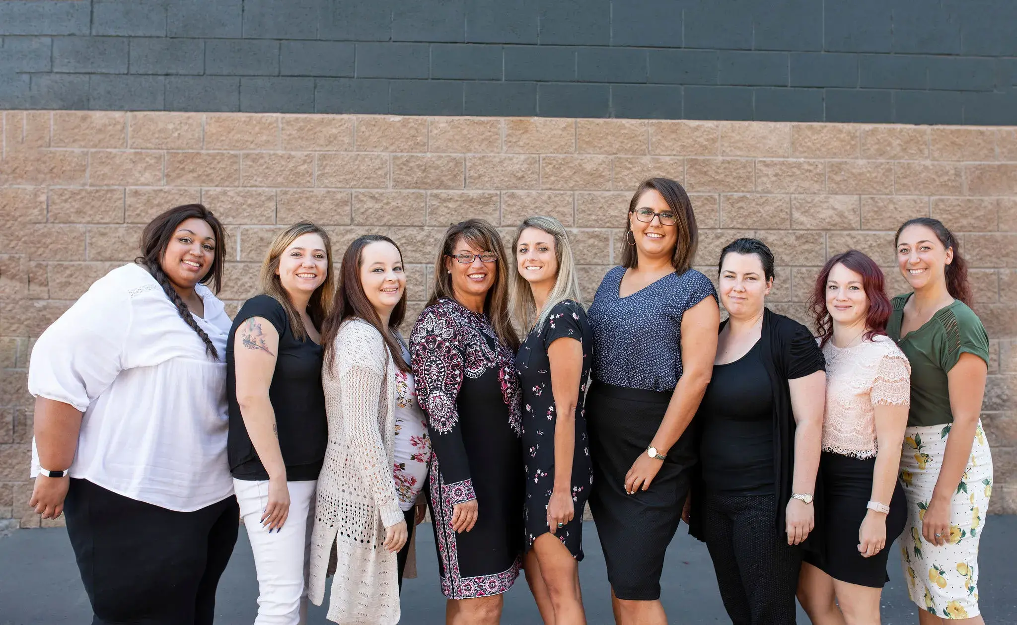 Customer service team standing in a row.