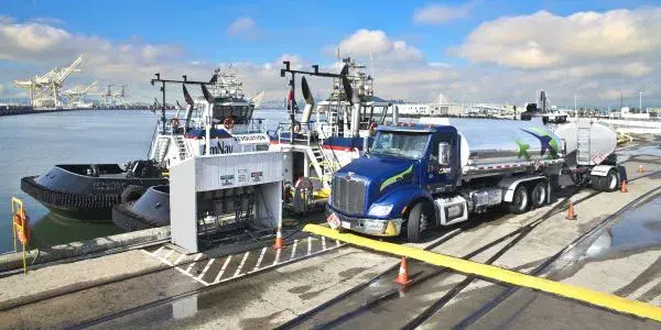 Flyers truck at the dock with several boats docked.