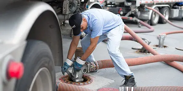 Driver handling fuel hoses