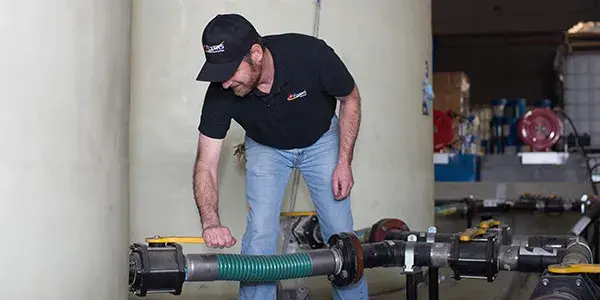 Flyers employee in the pump room turning on valve