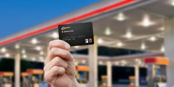 hand holding a Flyers and Quick Fuel fleet credit card
